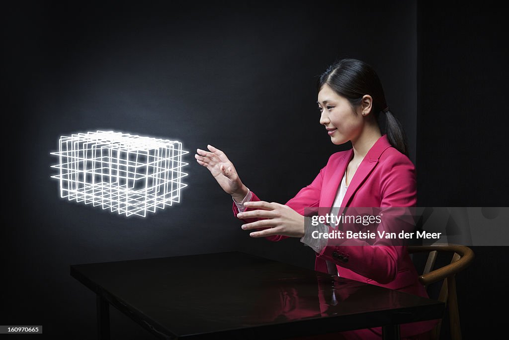 Woman looking at custommade virtual 3D model..