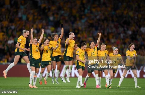 Players of Australia celebrate as Mackenzie Arnold of Australia saves the first penalty of France from Selma Bacha of France in the penalty shoot out...