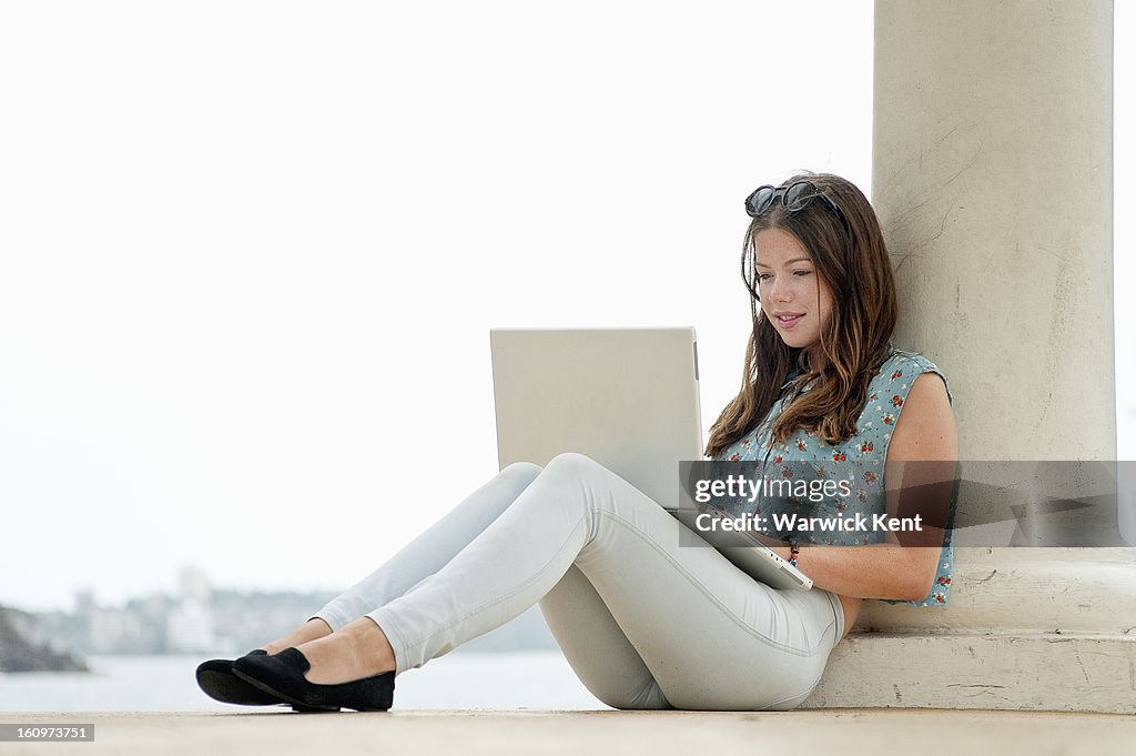 Young girl at beach relaxing.