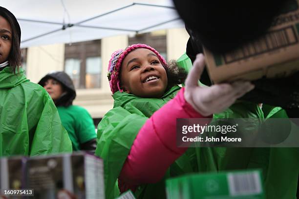 Girl Scouts sells cookies as a winter storm moves in on February 8, 2013 in New York City. The scouts did brisk business, setting up shop in...