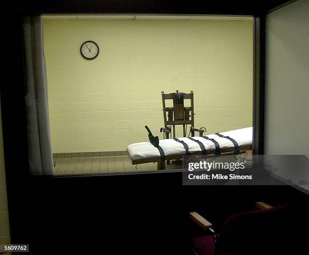 View of the death chamber from the witness room at the Southern Ohio Correctional Facility shows an electric chair and gurney August 29, 2001 in...