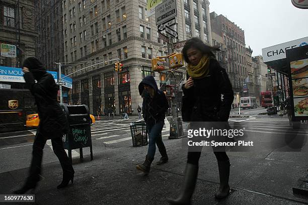 Pedestrians battle wind, snow and sleet as Manhattan prepares for a major winter storm on February 8, 2013 in New York City. New York City and much...