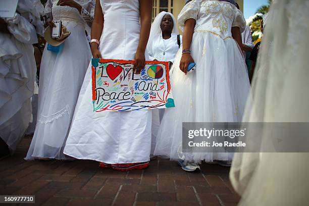 College students wear wedding gowns as they participate in the College Bride's Walk from Barry University on February 8, 2013 in Miami Shores,...