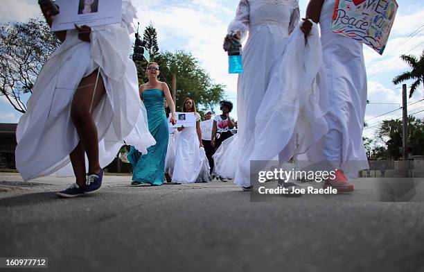 College students wear wedding gowns as they participate in the College Bride's Walk from Barry University on February 8, 2013 in Miami Shores,...