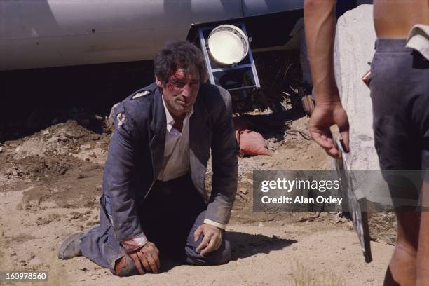 Tattered, torn and bloodied with movie makeup, James Bond 007 played by Timothy Dalton prepares for a fight scene during the filming of "Licence to...