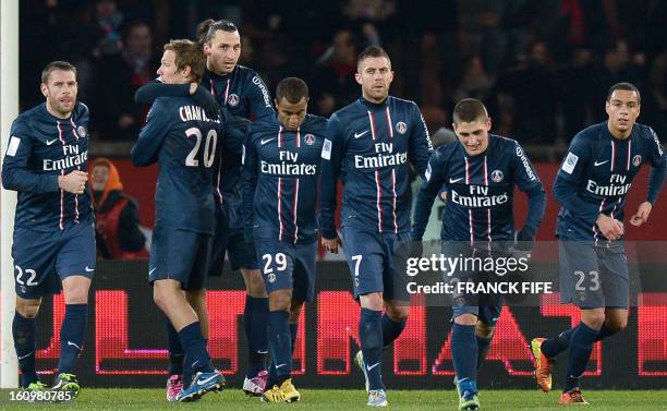 Paris Saint-Germain's Swedish forward Zlatan Ibrahimovic celebrates with teammates after scoring a goal during the French L1 football match Paris...