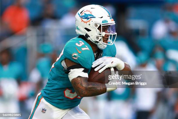 Myles Gaskin of the Miami Dolphins carries the ball against the Atlanta Falcons during the first quarter in a preseason game at Hard Rock Stadium on...