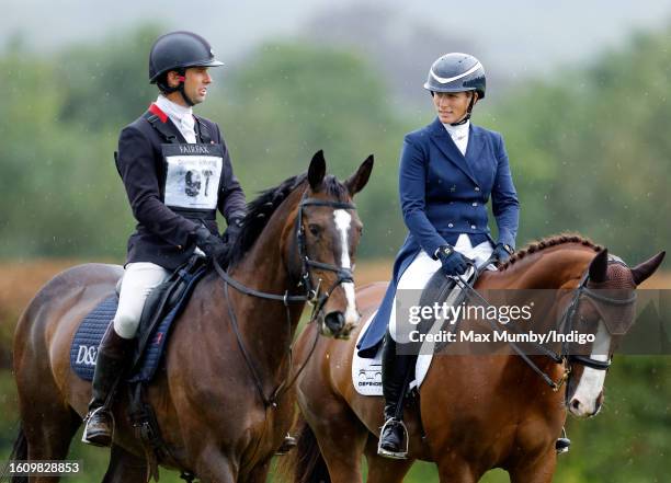 Harry Meade and Zara Tindall warms up on their horses 'Amiro Island' and 'Class Affair' before competing in the dressage phase of the 2023 Festival...