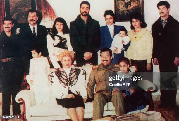 Undated photo of Iraqi President Saddam Hussein and his family in Bagdad showing Hussein 's sons-in-law, General Hussein Kamel Hassan and his brother...