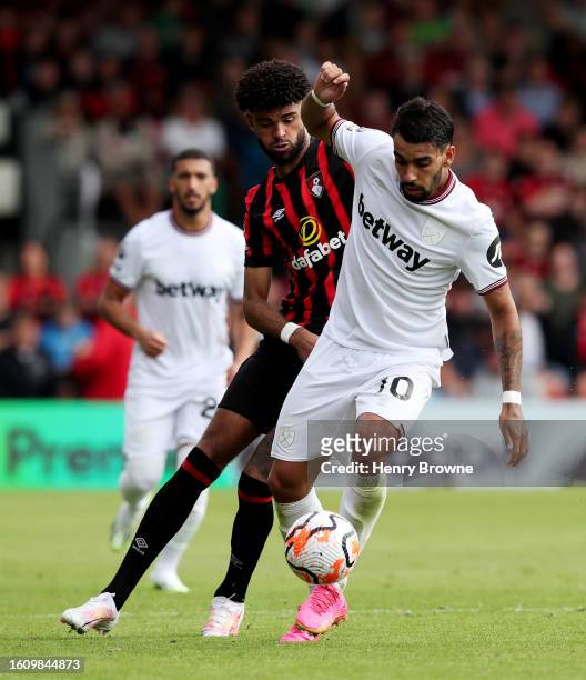 Lucas Paqueta of West Ham United is challenged by Philip Billing of AFC Bournemouth during the Premier League match between AFC Bournemouth and West...