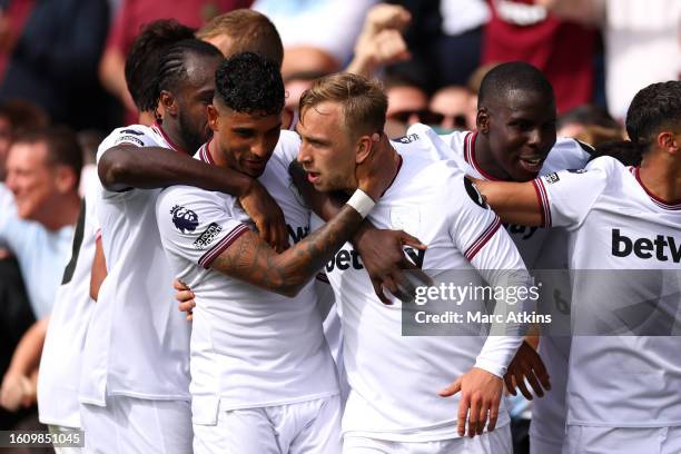 Jarrod Bowen of West Ham United celebrates with teammates after scoring the team's first goal during the Premier League match between AFC Bournemouth...