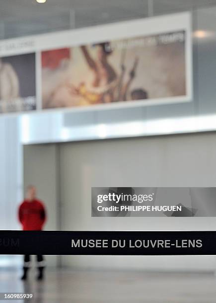 Security guard blocks the entrance of the "Galerie du Temps" at the Louvre-Lens Museum in the French northern city of Lens, on February 8, 2013 after...