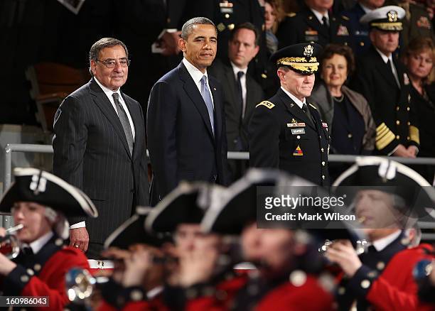 President Barack Obama stands with Secretary of Defense Leon Panetta and U.S. Army General Martin E. Dempsey, chairman of the Joint Chiefs of Staff,...