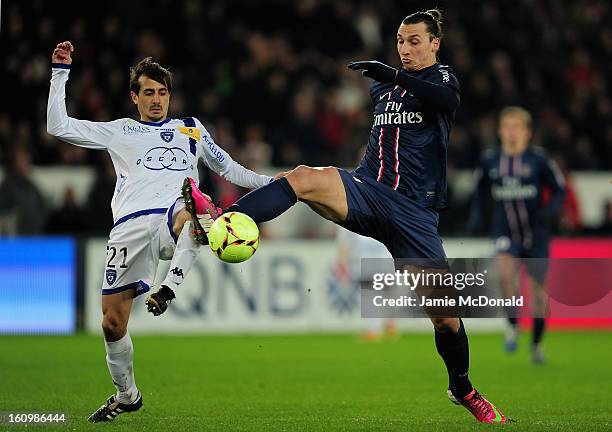 Zlatan Ibrahimovic of Paris Saint-Germain battles with Fethi Harek of SC Bastia during the Ligue 1 match between Paris Saint-Germain FC and SC Bastia...