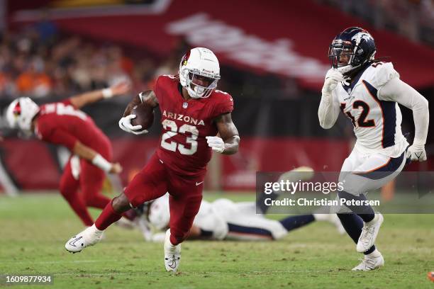 Running back Corey Clement of the Arizona Cardinals rushes the football against linebacker Nik Bonitto of the Denver Broncos during the first half of...