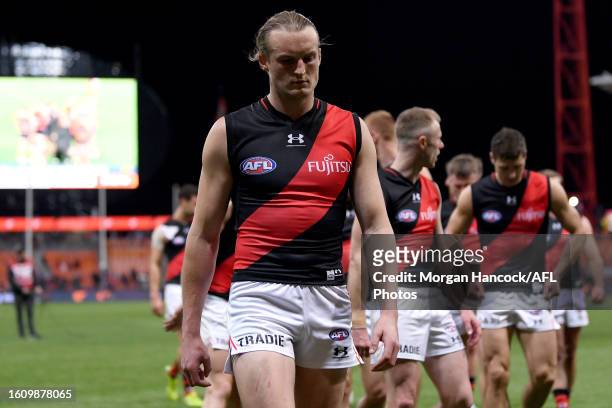 Mason Redman of the Bombers reacts following the 2023 AFL Round 23 match between the GWS GIANTS and the Essendon Bombers at GIANTS Stadium on August...