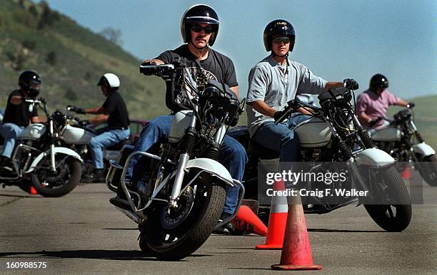 Westminister police officer Jack Bell takes a leads a group of officers during a motorcycle train exercise at Bandimere Speedway. Bell is one of 6...
