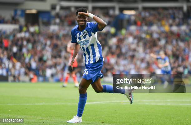 Simon Adingra of Brighton & Hove Albion celebrates after scoring the team's third goal during the Premier League match between Brighton & Hove Albion...