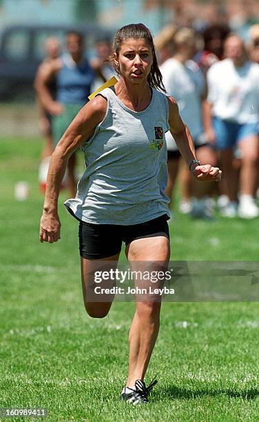 Lisa McCaffrey, wife of Broncos wide reciever Ed McCaffrey, turn on the afterburners as she gets timed for a 5.0 in the 40yard dash Eduring the WPFL...