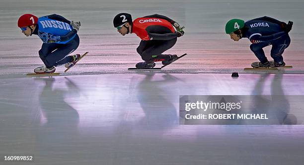 Ruslan Zakharov of Russia, Francois Hamelin of Canada and Yun-Jae Kim of Korea compete at the men's 1500m heat race of the ISU World Cup short track...