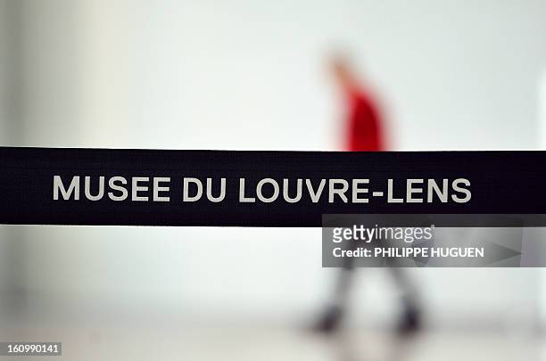 Cordon and a security guard block the entrance of the "Galerie du Temps" at the Louvre-Lens Museum in the French northern city of Lens, on February...