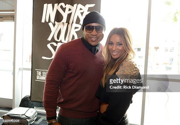 Host LL Cool J and singer Ciara pose backstage at the GRAMMYs Dial Global Radio Remotes during The 55th Annual GRAMMY Awards at the STAPLES Center on...