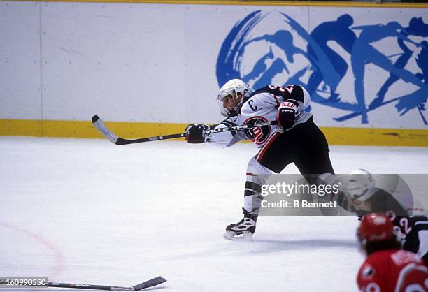 Cammi Granato of Team USA shoots during the women's first round match against Team Canada at the 1998 Nagano Winter Olympics on February 14, 1998 at...
