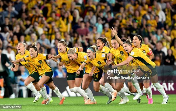 Players of Australia celebrate their side's victory in the penalty shoot out after Cortnee Vine of Australia scores her team's tenth penalty in the...