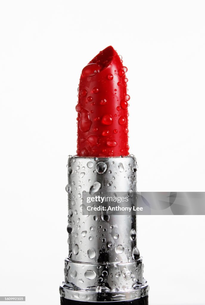 "Close up of wet, red lipstick"