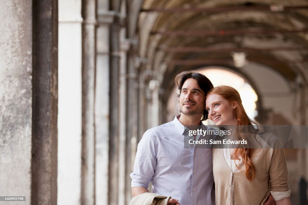 Smiling couple in corridor in Venice