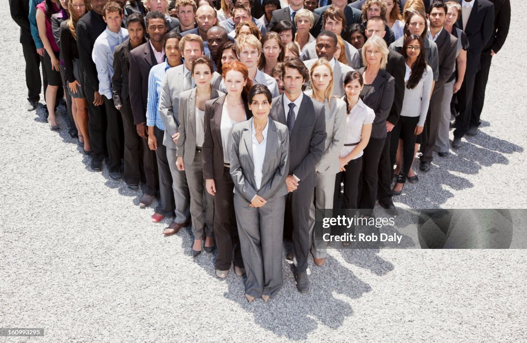 Portrait of business people forming triangle