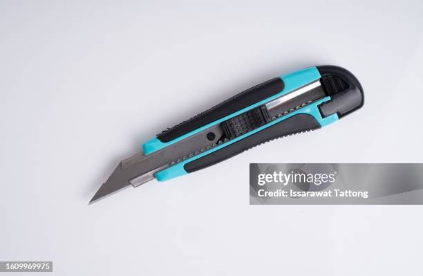 side view of blue utility knife isolated on white background - craft knife stock pictures, royalty-free photos & images