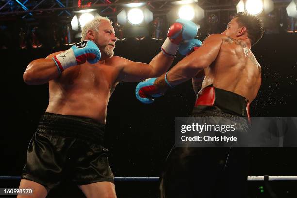 Francois Botha punches Sonny Bill Williams during their heavyweight bout at the Brisbane Entertainment Centre on February 8, 2013 in Brisbane,...