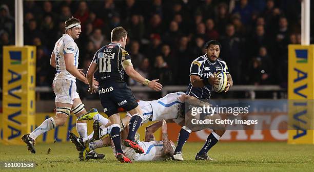 Johnny Leota of Sale Sharks looks to off load the ball to Mark Cueto during the Aviva Premiership match between Sale Sharks and Exeter Chiefs at...