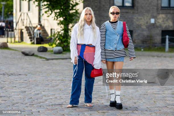Guest wears white button shirt asymmetric skirt, denim jeans and a guest wears denim vest, mini skirt, black white striped shirt with long sleeves...