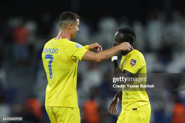 Cristiano Ronaldo of Al Nassr celebrates with teammate Sadio Mane after scoring the team's second goal during the Arab Club Champions Cup Final...