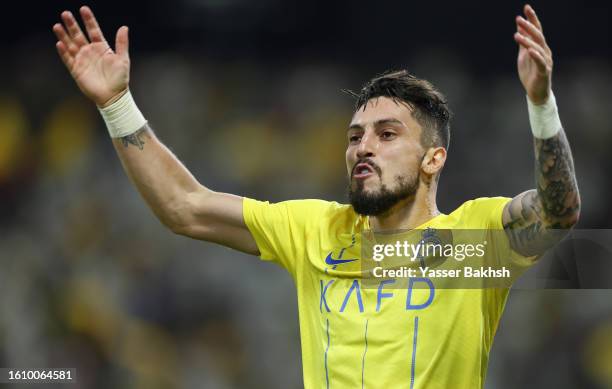 Alex Telles of Al Nassr celebrates after teammate Cristiano Ronaldo scores the team's second goal during the Arab Club Champions Cup Final between Al...