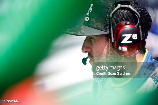 Chase Elliott, driver of the NAPA Auto Parts Chevrolet, looks on during practice for the NASCAR Cup Series Verizon 200 at the Brickyard at...
