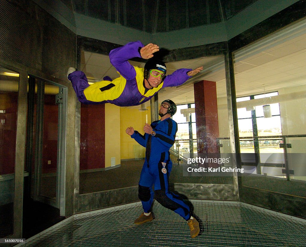 LONE TREE, CO (03-01-2006) -- Cameron Welch was suspended in midair as giant fans blew enough air to keep him up. SkyVenture Colorado is a vertical wind tunnel designed to bring a safe flight experience to the publilc. The company uses four 300 horsepower