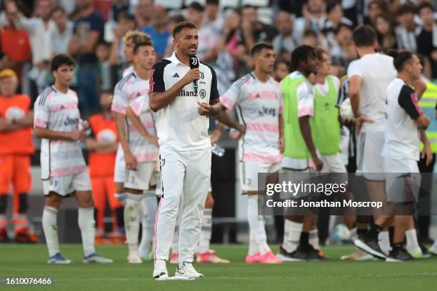 Danilo of Juventus addresses the fans using a microphone following during the training match at Allianz Stadium on August 09, 2023 in Turin, Italy.