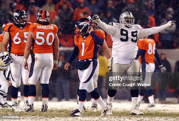 Dejected Jason Elam walks off the field after a blocked a field goal in the 4th quarter of the game between the Denver Bronco and the Oakland Raiders...