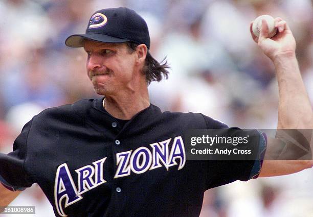 Randy Johnson, Arizona Diamondbacks, pitches during the third inning against the Colorado Rockies at Coors Field Sunday afternoon. THE DENVER POST/...