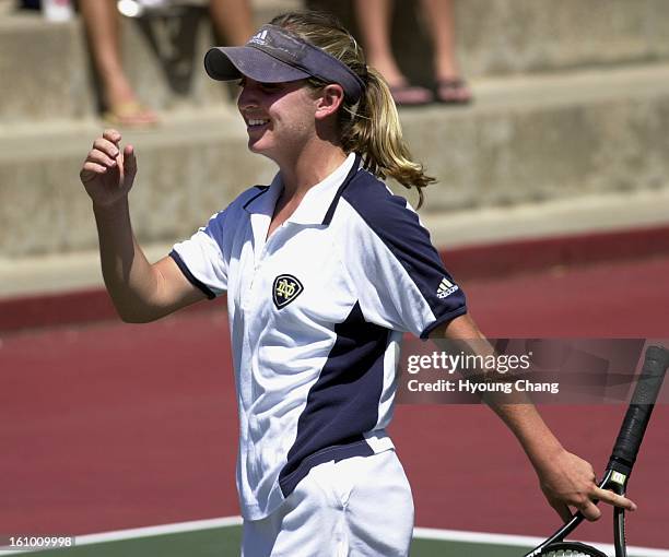 Becky Varnum celebrates her win at the Colorado State Open, 2001 women's singles championship game against Heather Polumbus at Gates Tennis Center on...