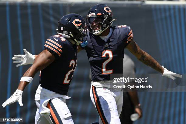 Khalil Herbert and DJ Moore of the Chicago Bears celebrate after a touchdown in the first quarter against the Tennessee Titans during a preseason...