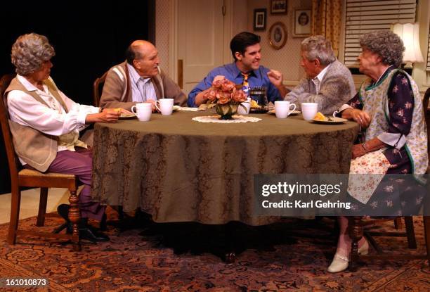 Eric Dente, center, plays the eligible grandson Nick who has to tell both sets of his grandparents that he is moving across the country for his job,...