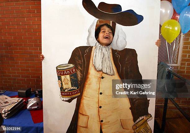 Alexis Gillespie, <cq> age 5, posed behind a cutout of the Quaker Oats character and laughily declared, "I'm the oatmeal man, I'm the oatmeal man,"...