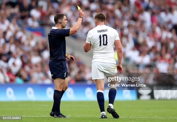 Referee Nika Amashukeli awards a yellow card to Owen Farrell of England after a high tackle on Taine Basham of Wales during the Summer International...