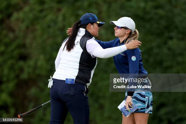 Angel Yin of the United States hugs Jodi Ewart Shadoff of England after finishing their rounf on the 18th hole during the Day Three of the AIG...