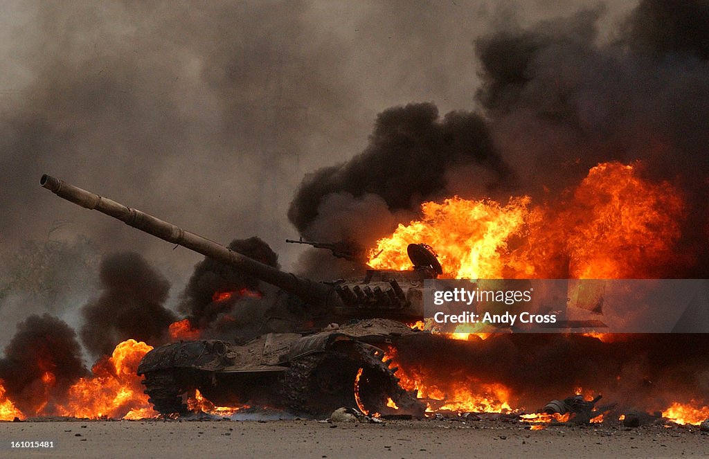 IRAQ--An Iraqi T72 tank erupts in flames after 2nd Tanks Battalion Bravo Company blew it up on their way to a blocking postition near the Tigris River eraly Wednesday morning on the outskirts of Saddam City, near the Tigris River. The tank had no personne