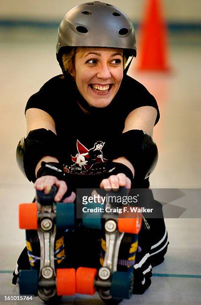 CO_Hermione Danger has un unsuspecting smile while stretching out before practice with the Rocky Mountain RollerGirls at the Roll-O-Rama in Thornton,...